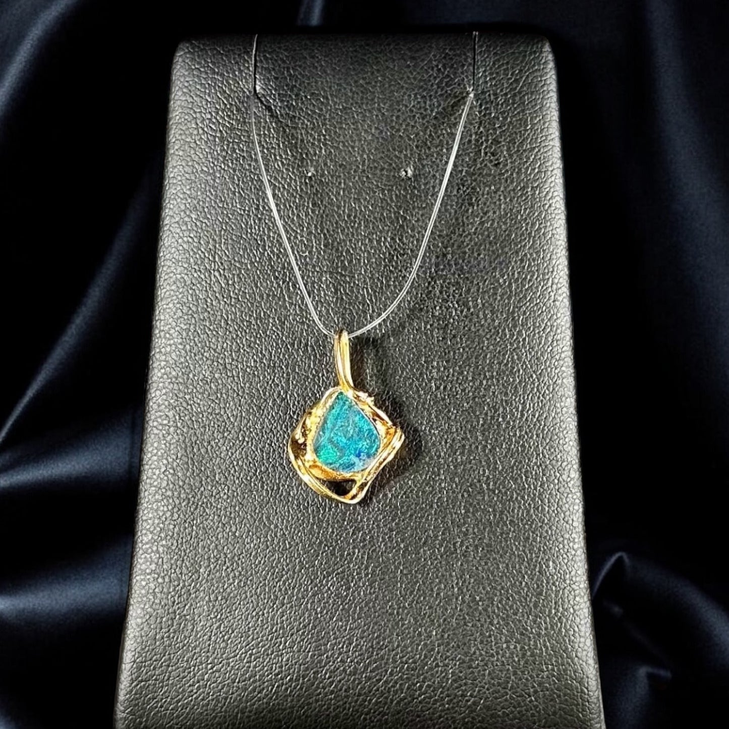 Boulder Opal Pendant set in 18K Gold. (Pendant only)